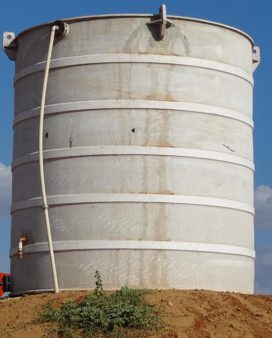 Process water storage tank serving the plant.